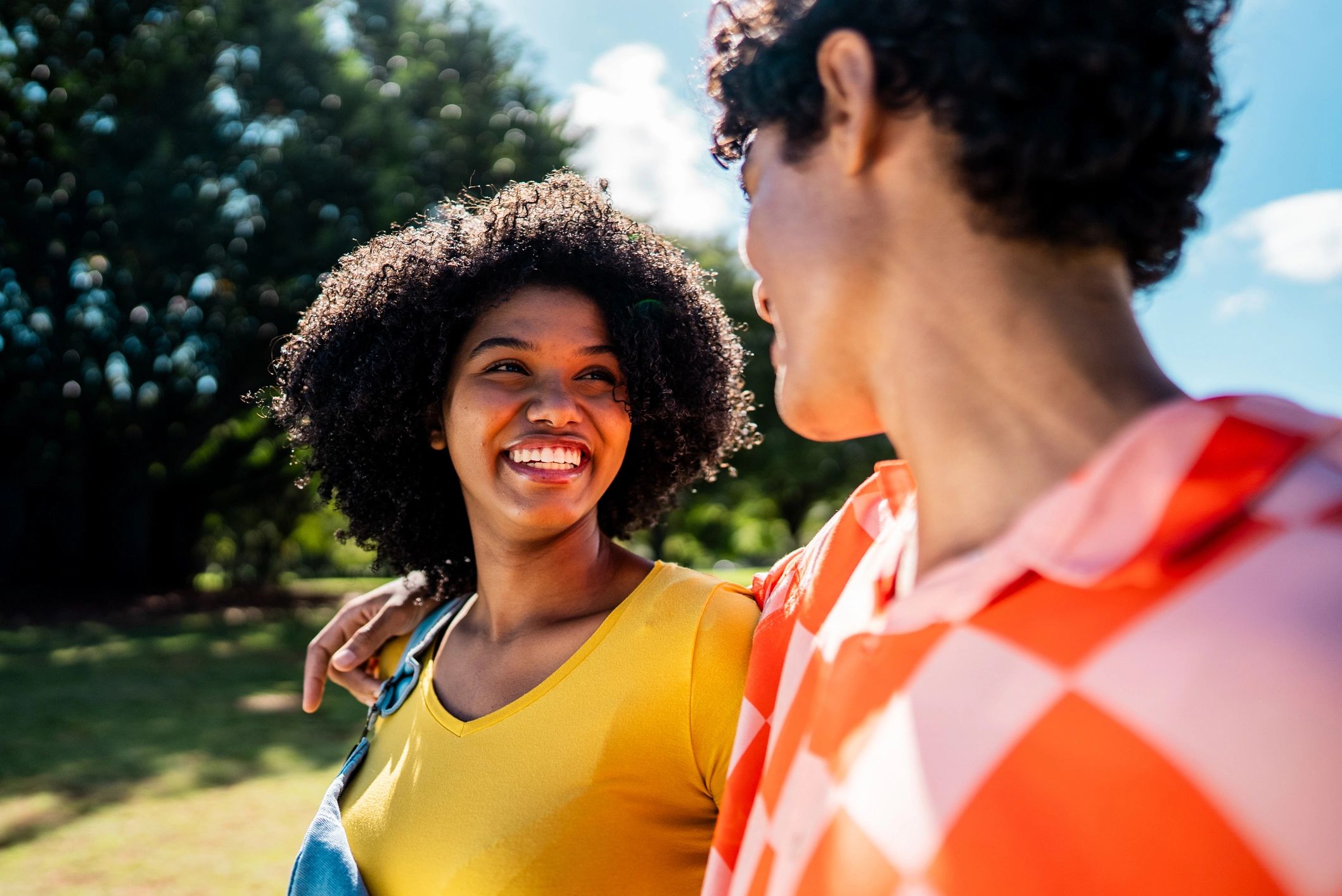 Young couple talking together in a park